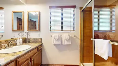 a bathroom with a sink and a shower at Snowflower #75 condo in Mammoth Lakes