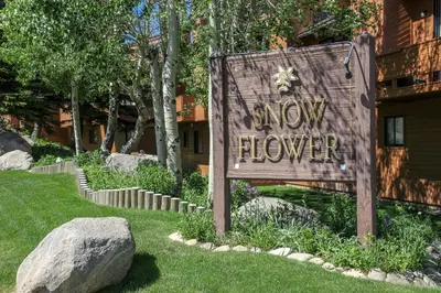 a sign that says slow flower in a yard at Snowflower #75 condo in Mammoth Lakes