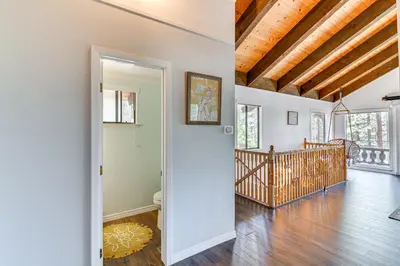 an open living room with a wooden ceiling at Near Skiing and Beach Access South Lake Tahoe Cabin in South Lake Tahoe