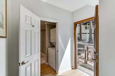 a hallway with a mirror next to a house at Near Skiing and Beach Access South Lake Tahoe Cabin in South Lake Tahoe