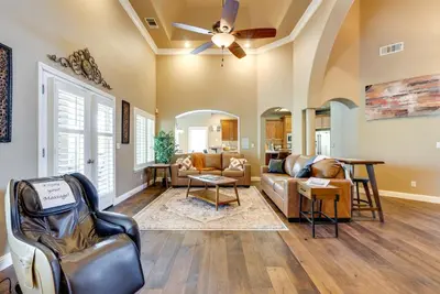 a living room with a ceiling fan and a couch at Clovis Retreat with Patio and Yard about 3 Mi to Old Town! in Clovis