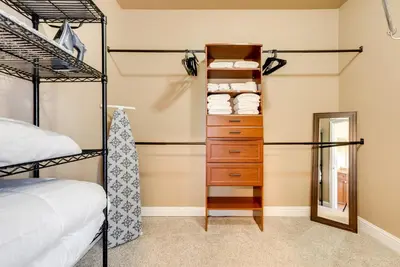 a bedroom with two bunk beds and a mirror at Clovis Retreat with Patio and Yard about 3 Mi to Old Town! in Clovis