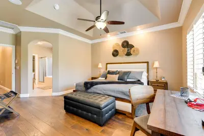 a bedroom with a bed and a ceiling fan at Clovis Retreat with Patio and Yard about 3 Mi to Old Town! in Clovis