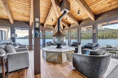 a living room with couches and a fireplace in a house at Spacious 1br Condo w/Partial Lake View #117 at Donner Lake Village in Truckee