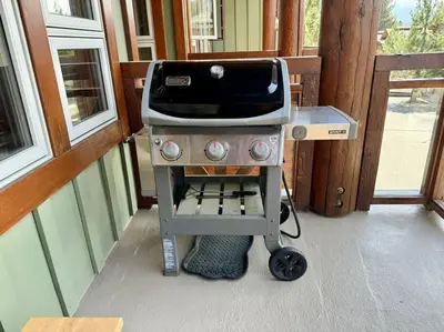 a grill sitting on a porch in a house at Luxury Townhome w/ Views, Private Jacuzzi & Garage in Mammoth Lakes