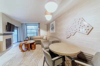 a living room with a couch and a table at Luxury 2 Bedroom Penthouse with Stunning Views! in Mammoth Lakes