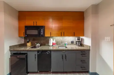 a kitchen with a sink and a microwave at Luxury 2 Bedroom Penthouse with Stunning Views! in Mammoth Lakes