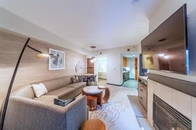 a living room with a couch and a fireplace at Luxury 2 Bedroom Penthouse with Stunning Views! in Mammoth Lakes