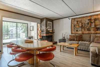 a living room with a table and a couch at Updated 2 Bedroom 2 Bathrooms 1849 Condos #109 Steps to Canyon Lodge Sleeps 6 in Mammoth Lakes