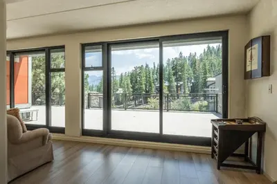 a living room with a large window with a view at Updated 2 Bedroom 2 Bathrooms 1849 Condos #109 Steps to Canyon Lodge Sleeps 6 in Mammoth Lakes