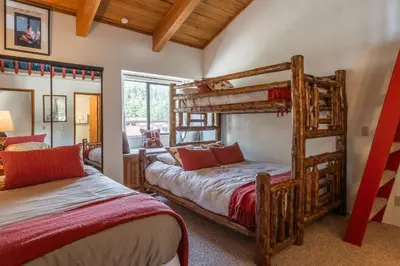 a bedroom with two bunk beds in a house at Courchevel #15 - 2 Bedroom, 2 Bathroom, Sleeps 6! Just steps to Canyon Lodge! in Mammoth Lakes