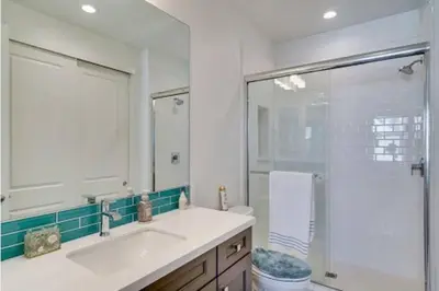 a bathroom with a sink and a shower and a toilet at Waterfront Resort Style Villa - 5 min to fastwater in Oakley