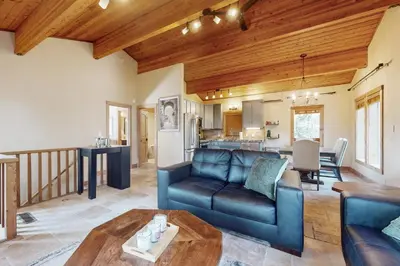 a living room with a couch and a table at Wild Horse Hideaway in Incline Village