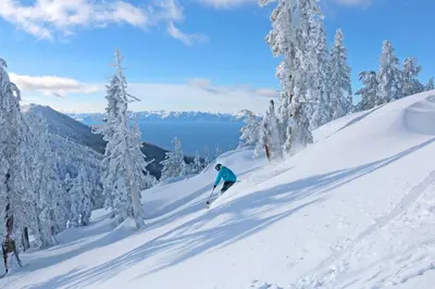 a person is skiing down a snow covered slope at Wild Horse Hideaway in Incline Village