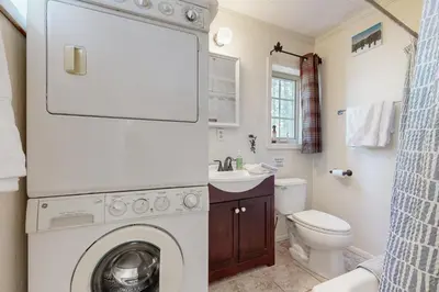 a bathroom with a washing machine and a toilet at 10 Mi to Bear Valley Resort Serene Mtn Retreat in Tamarack