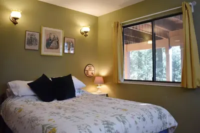 a bedroom with a large bed and a window at HighlandHouse in Arnold