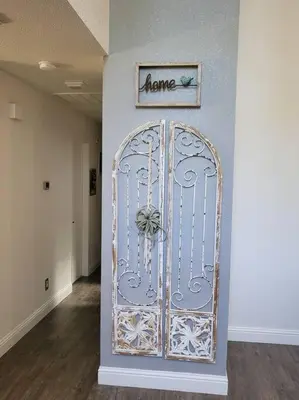 a door in a hallway with a sign that reads home at 3 Bedrooms,Beautiful House with Hot Tub, Pool Oasis and Fire Pit in Clovis