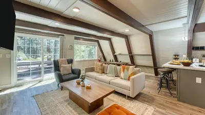 a living room with a couch and a table at Speckled by AvantStay Modern Interior 0.5mi to Lake in Kings Beach