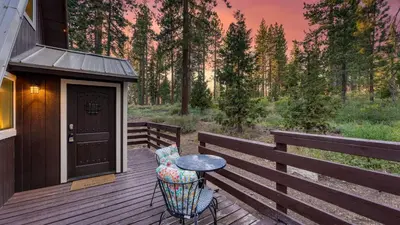 a wooden deck with a table and chairs on a house at Speckled by AvantStay Modern Interior 0.5mi to Lake in Kings Beach
