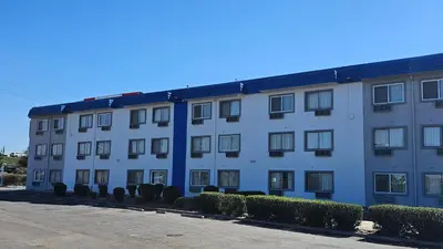 a large white building with a lot of windows at MetroParc 'nSuites in Stockton
