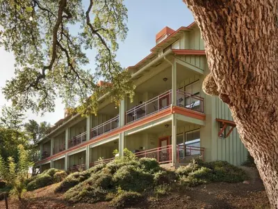 an exterior view of a building with a tree at WorldMark Angels Camp - 2BD in Angels Camp