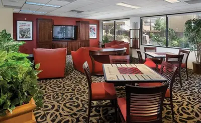 a restaurant with tables and chairs in a room at Great 1BD condo with resort amenities take in all Reno has to offer in Reno