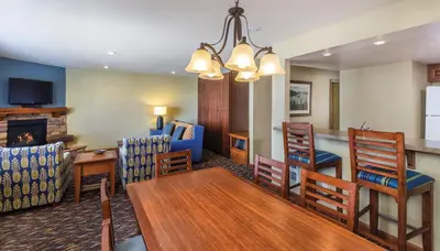 a dining room and living room with a table and chairs at Worldmark Lake Tahoe - 2BD Sleeps up to 6 in Stateline