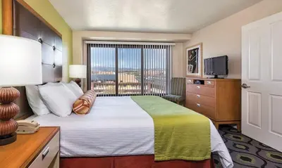 a hotel room with a bed and a television at Enjoy all Reno has to offer in this 2BD resort condo with outdoor pool or hot tub in Reno