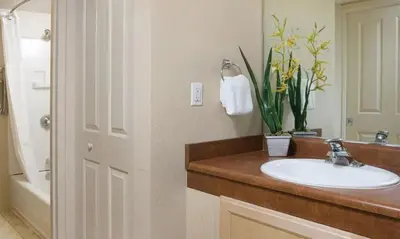 a bathroom with a sink and a toilet and a tub at Enjoy all Reno has to offer in this 2BD resort condo with outdoor pool or hot tub in Reno
