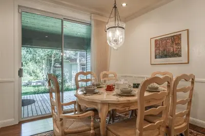 a dining room with a table and chairs at Snowcreek IV 525 in Mammoth Lakes