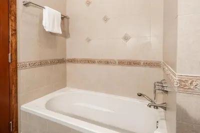 a white bath tub in a bathroom at Snowcreek IV 525 in Mammoth Lakes