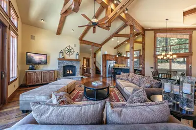 a large living room with couches and a fireplace at Compass Luxury Lodge - Access to HOA and Free Shuttle! in Truckee