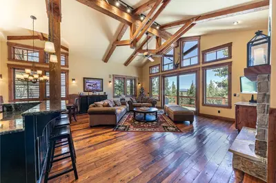 a living room with a couch and a table at Compass Luxury Lodge - Access to HOA and Free Shuttle! in Truckee