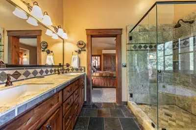 a bathroom with a shower and a sink at Compass Luxury Lodge - Access to HOA and Free Shuttle! in Truckee
