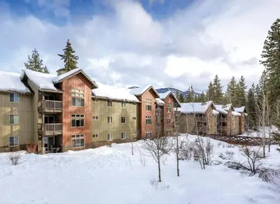 an apartment complex in the winter with snow on the ground at Wyndham South Shore 1Bd- sleeps 4 in Zephyr Cove