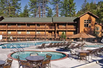 a resort with a swimming pool with tables and chairs at Wyndham South Shore 1Bd- sleeps 4 in Zephyr Cove