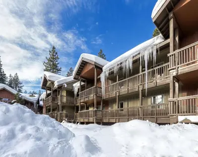 a building with snow in front of it at Wyndham South Shore 2bd sleeps 6 in Zephyr Cove