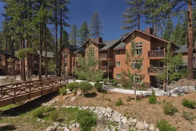 an exterior view of an apartment building with a bridge at Wyndham South Shore 2bd sleeps 6 in Zephyr Cove