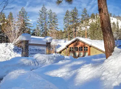 a sign in the snow in front of a cabin at Worldmark South Shore 2bd- sleeps 6 in Zephyr Cove