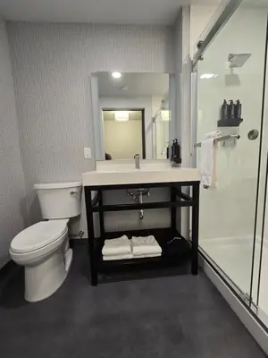 a bathroom with a sink and a toilet and a shower at My TRI Suites Reno Sparks in Clark