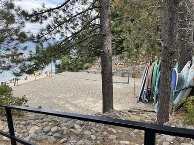 a beach with a bunch of surfboards on it at Lakeview Cabin in Tahoma