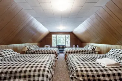 a room with three beds in a room at 3 Mi to State Park Quiet Escape with Deck in Arnold in Dorrington