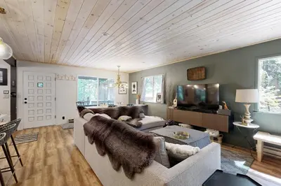 a living room with a couch and a tv at 3 Mi to State Park Quiet Escape with Deck in Arnold in Dorrington