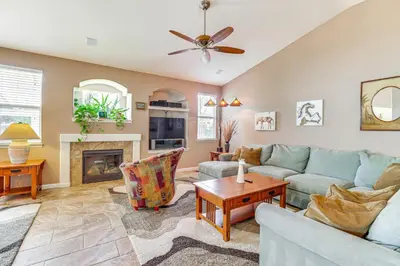 a living room with a couch and a fireplace at Game Room and Fireplace Reno Home 5 Mi to Dtwn! in Reno
