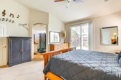 a bedroom with a bed and a large window at Game Room and Fireplace Reno Home 5 Mi to Dtwn! in Reno