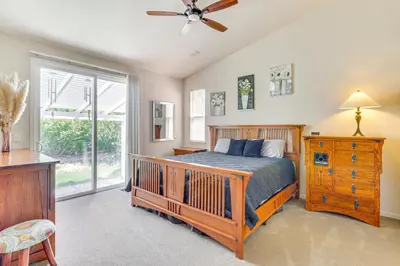 a bedroom with a bed and a ceiling fan at Game Room and Fireplace Reno Home 5 Mi to Dtwn! in Reno