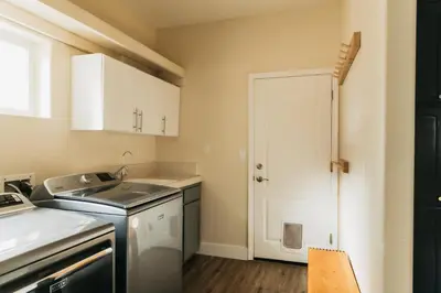 a small kitchen with a sink and a stove at Panoramic Lookout Sierra Serenity BBQ by CasaOso in Mariposa