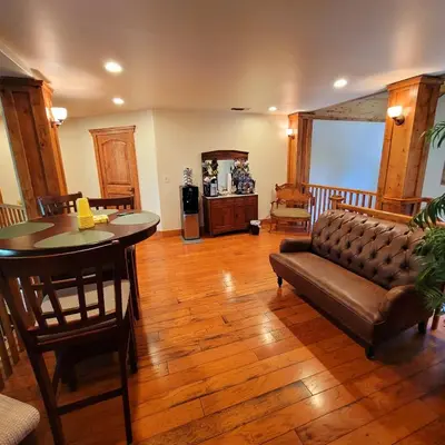 a living room with a couch and a table at Kings River Reflections in Sanger