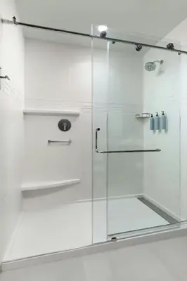 a shower with a glass door in a bathroom at Residence Inn by Marriott Sacramento Cal Expo in Sacramento