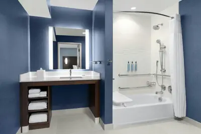 a bathroom with a sink and a tub and a shower at Residence Inn by Marriott Sacramento Cal Expo in Sacramento